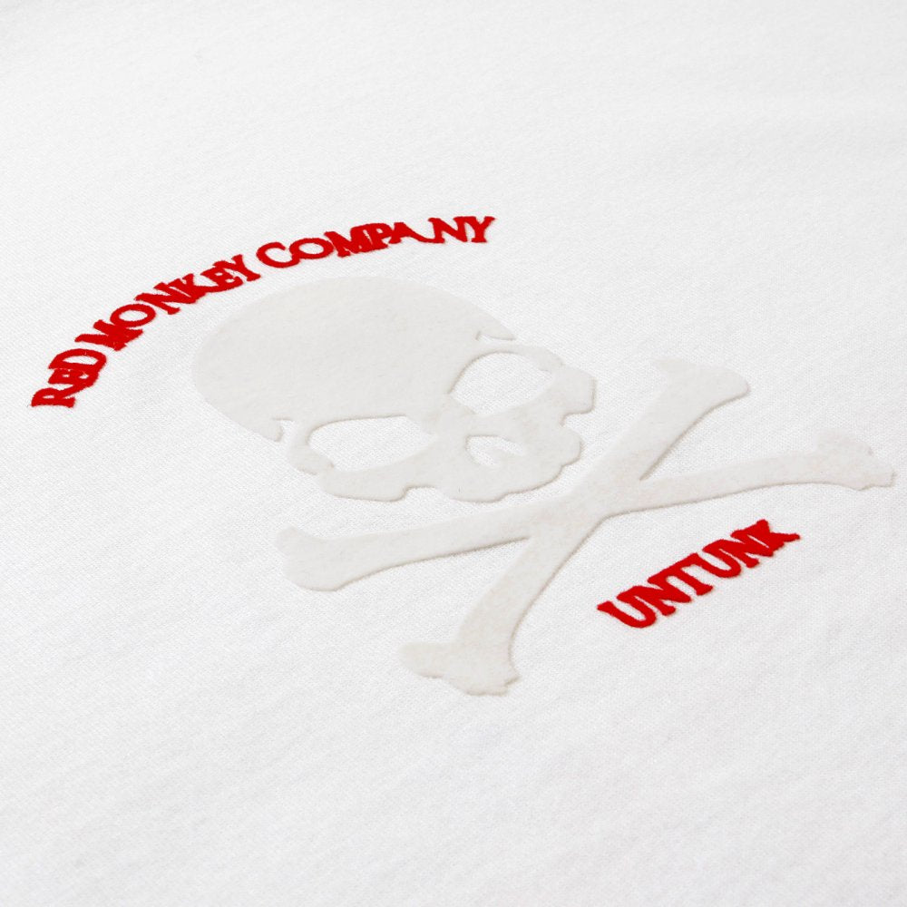 White Crew Neck Short Sleeve Regular Fit T Shirt with Large Ivory Skull and Crossbones Flock Print