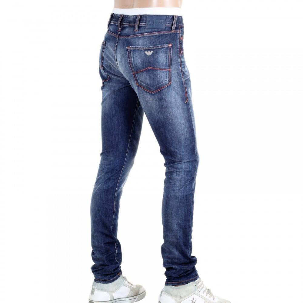 Worn Finished Heavily Faded Extra Slim J35 Washed Denim Jeans with Styled Creasing and A Repair Patch