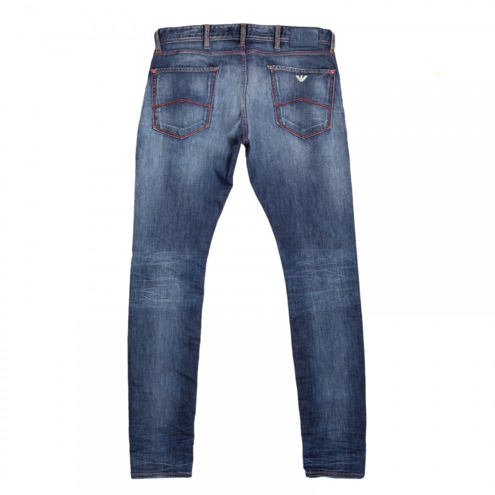 Worn Finished Heavily Faded Extra Slim J35 Washed Denim Jeans with Styled Creasing and A Repair Patch