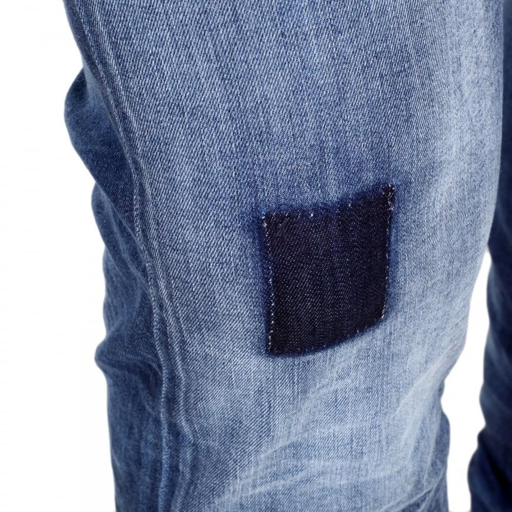 Worn Finished Heavily Faded Extra Slim J35 Washed Denim Jeans with Styled Creasing and A Repair Patch