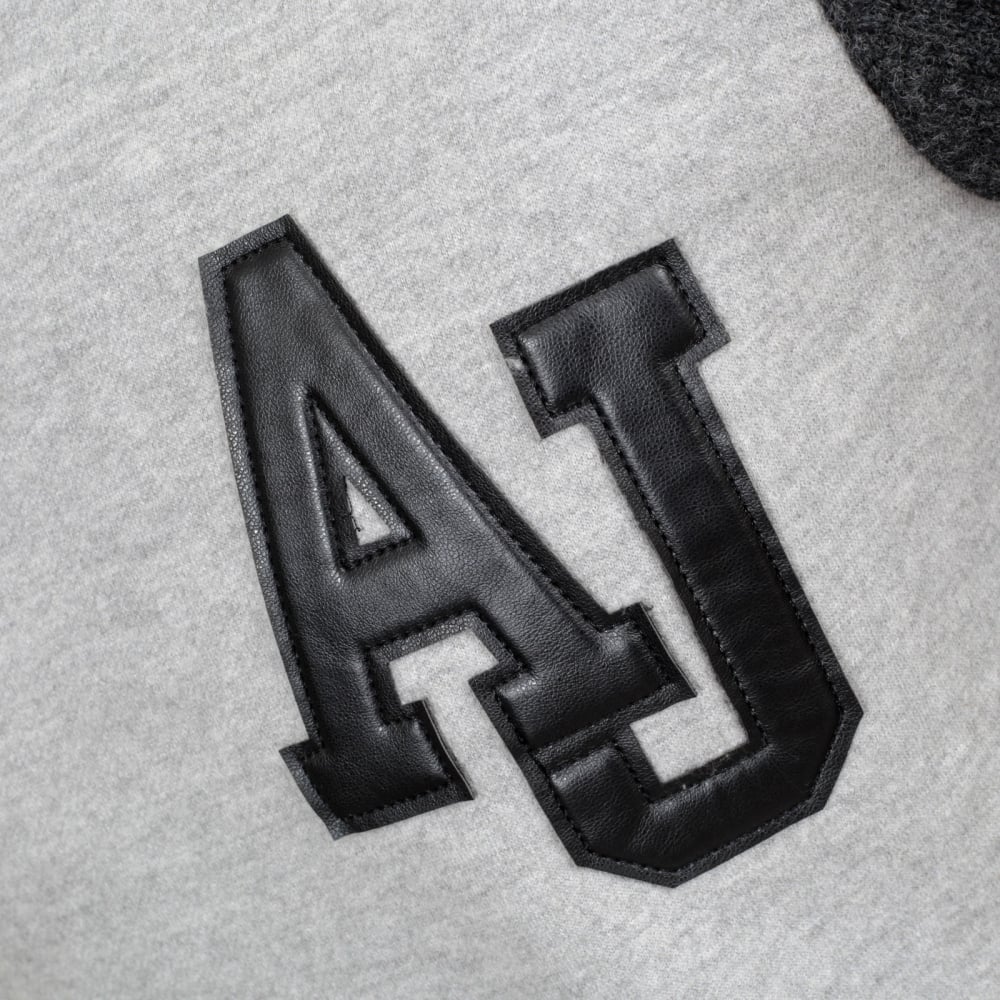 Crew Neck Grey Sweatshirt with Darker Grey Knitted Back and Sleeves with Pleather AJ Applique Chest Logo